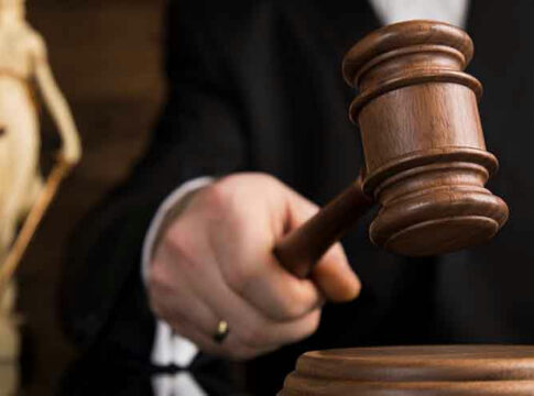 Gavel being struck on a sound block.