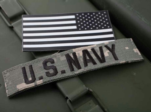 U.S. Navy patch and monochrome American flag patch.