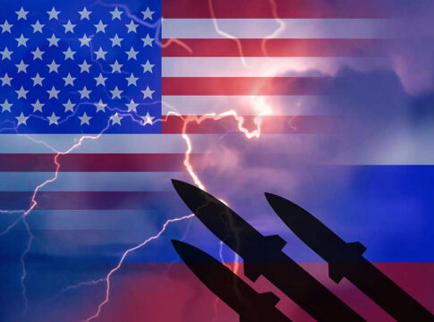 USA and Russia flags with missiles and lightning bolts.