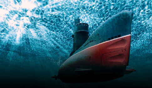 Submarine underwater with light filtering from the surface.